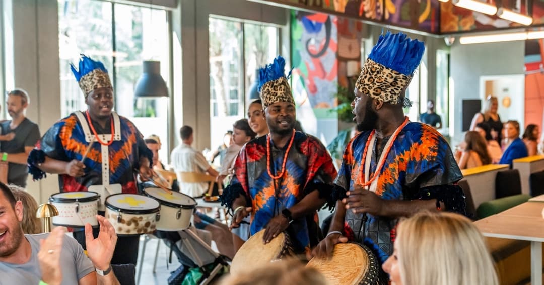 Traditional African drummers performing at Alkebulan Food Hall, Expo City Dubai, entertaining guests.