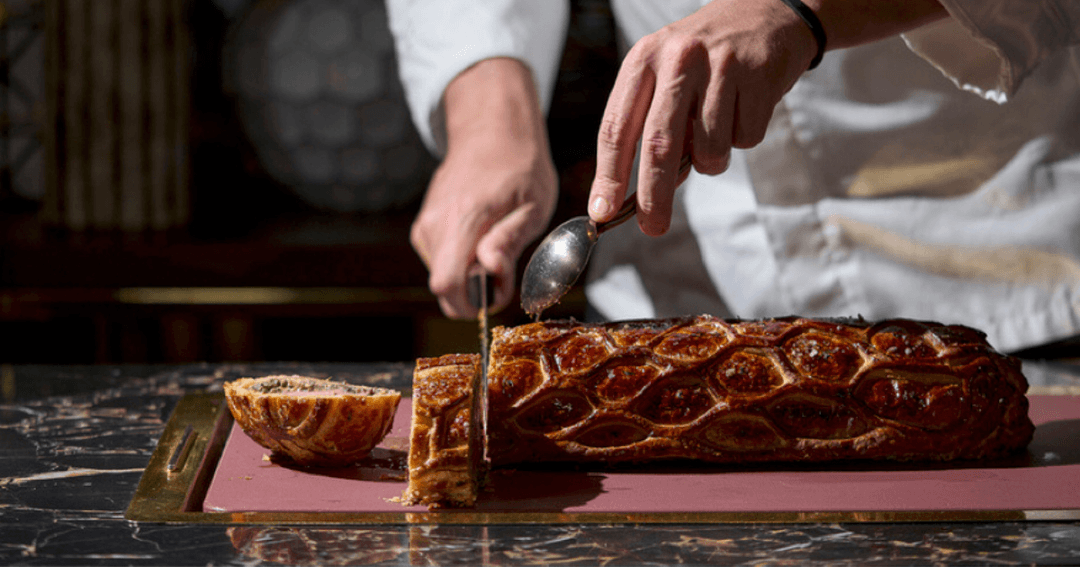 cutting steak at bull & bear by marc hardiman