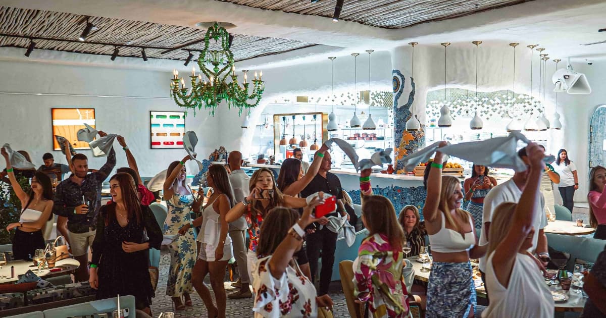 Group of people dancing in a restaurant