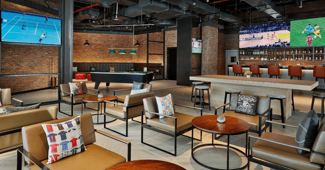 Seven Sports Bar's inside area with live sports on the screens