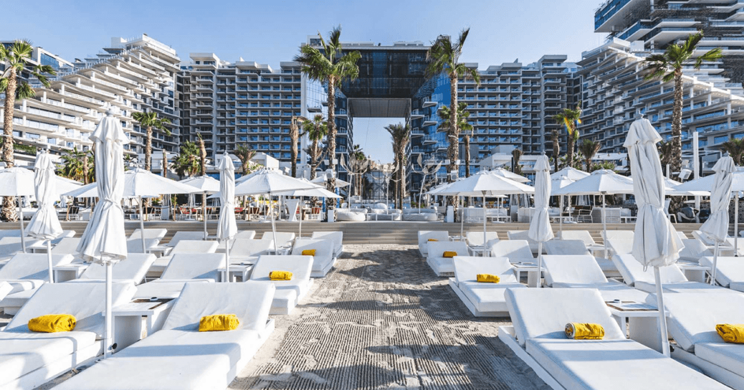 Sunbeds with hotel in the background