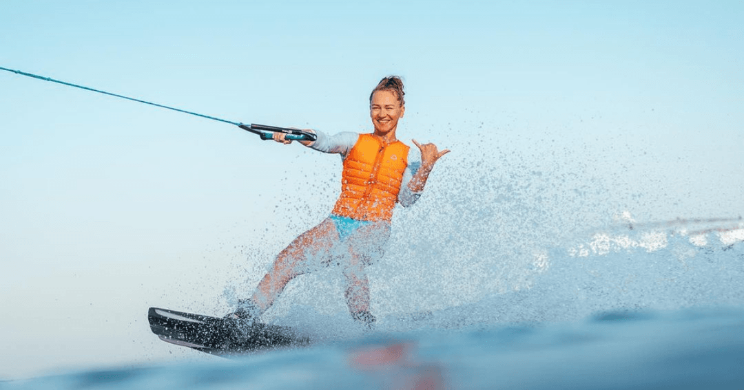 Lady enjoying herself Wakeboarding wit Ultimate Wake