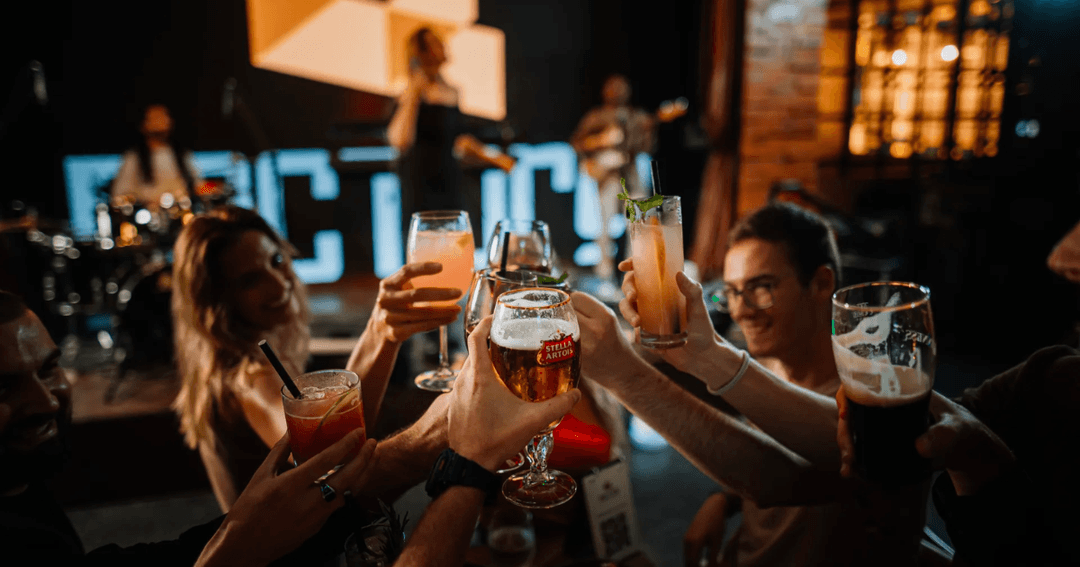 Group of people toasting while enjoying the ambience at McGettigan's Factory