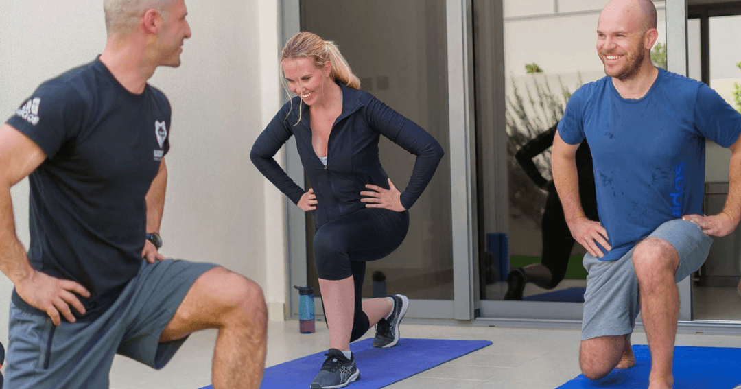 Couple training at home with a personal trainer fro Lucky's.