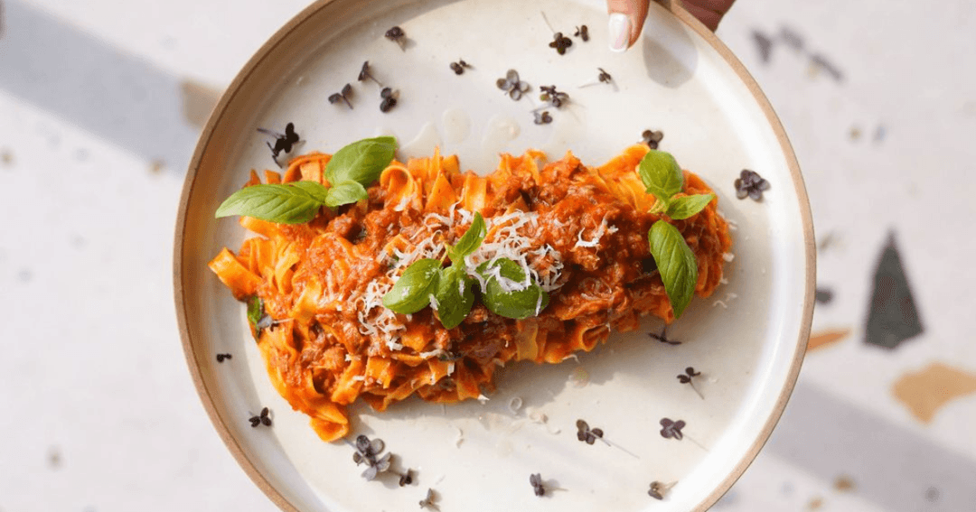 Pasta dish being served