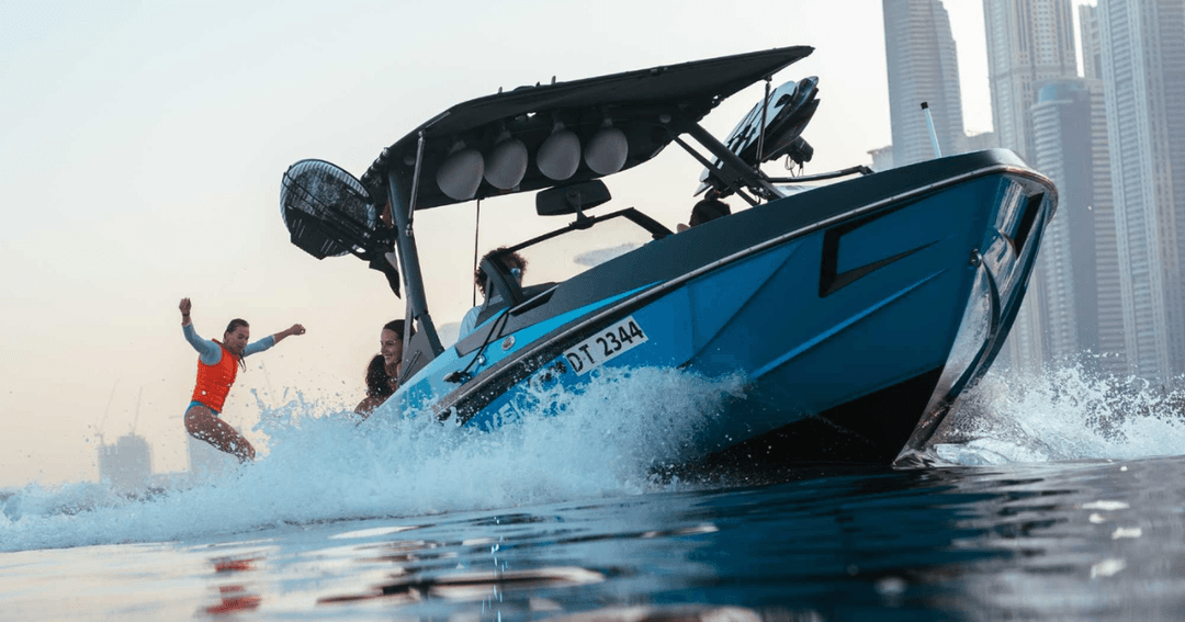 Ultimate Wake's boat and woman wakeboarding