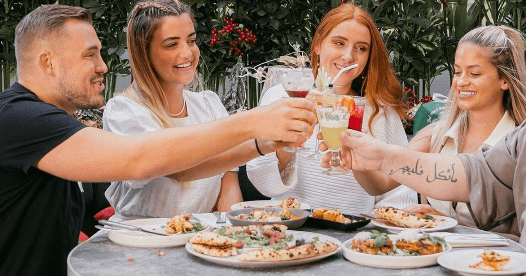 Guest toasting at Motorino