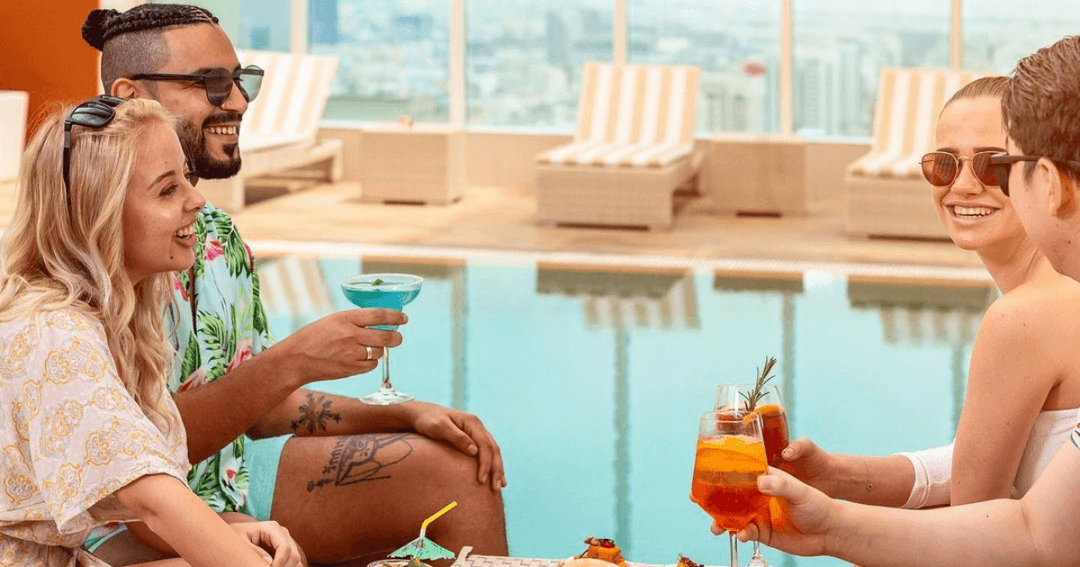 Guest dining and drinking poolside