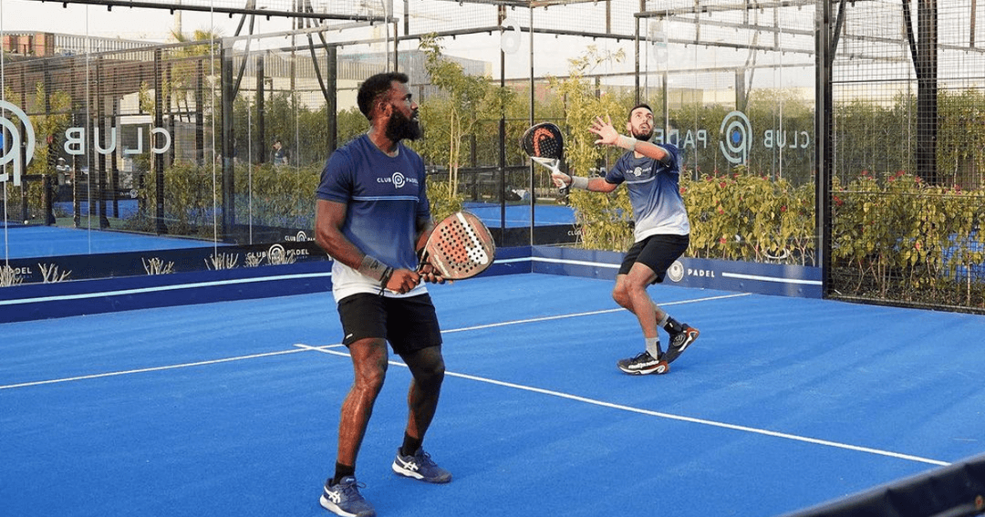 Two men playing padel