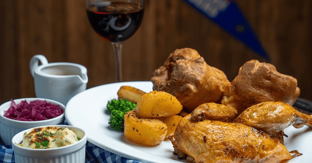 Sunday roast served with a glass of wine