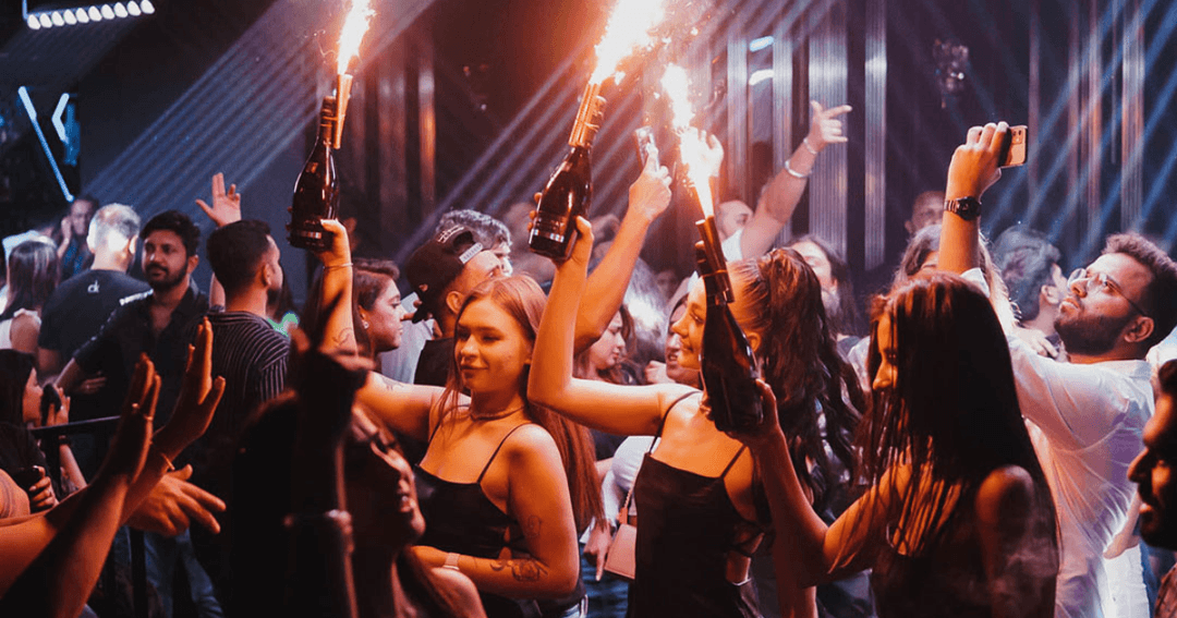 Waitress serving champagne at a club