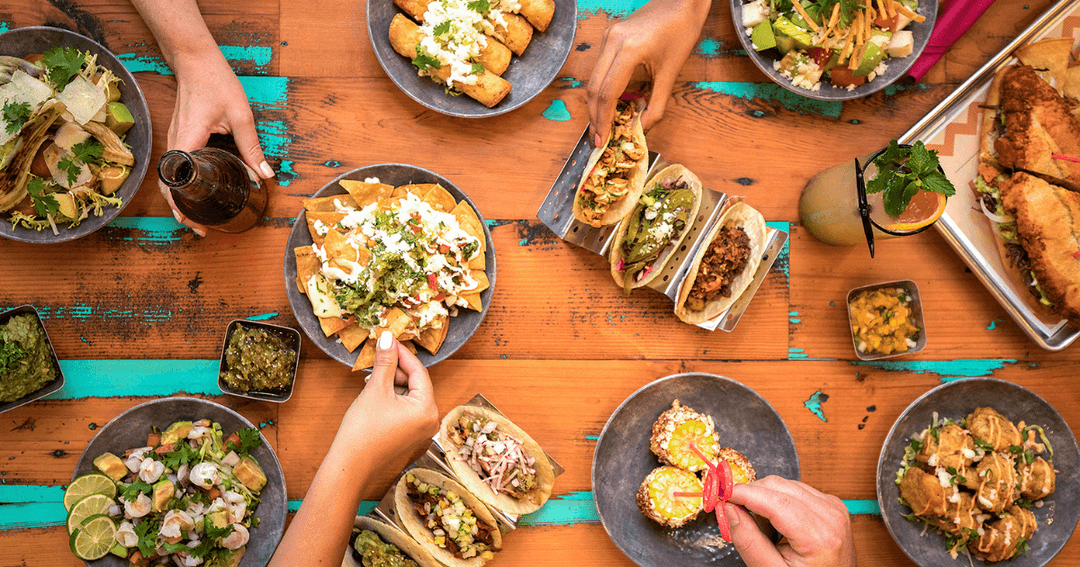 table filled with mexican dishes