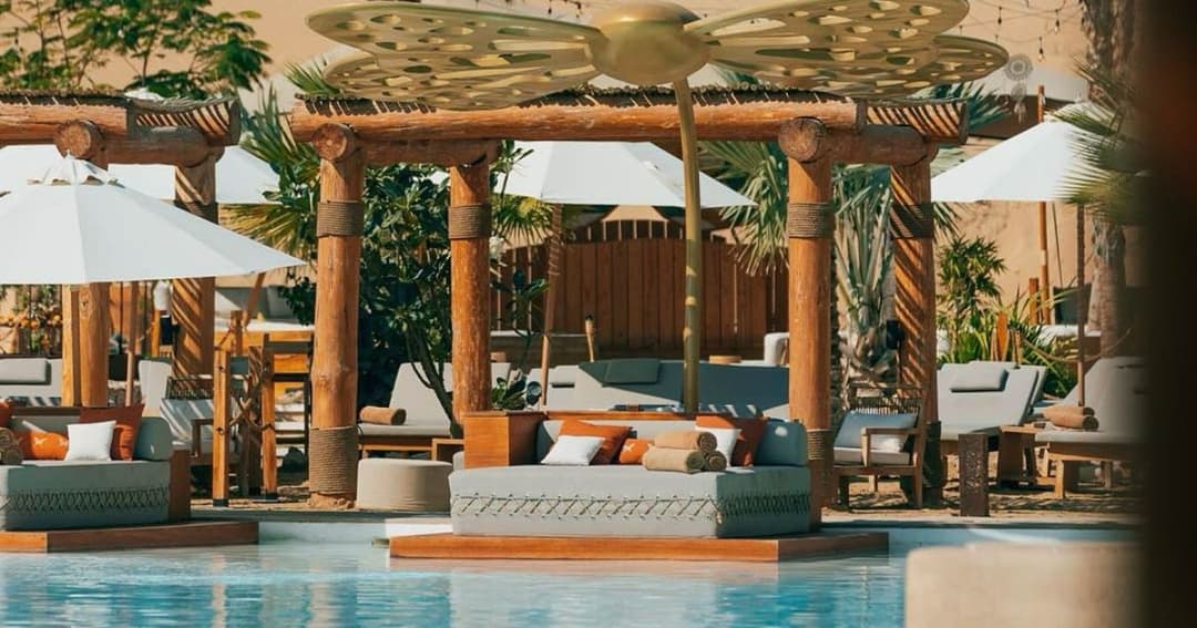 Sun loungers next to a pool