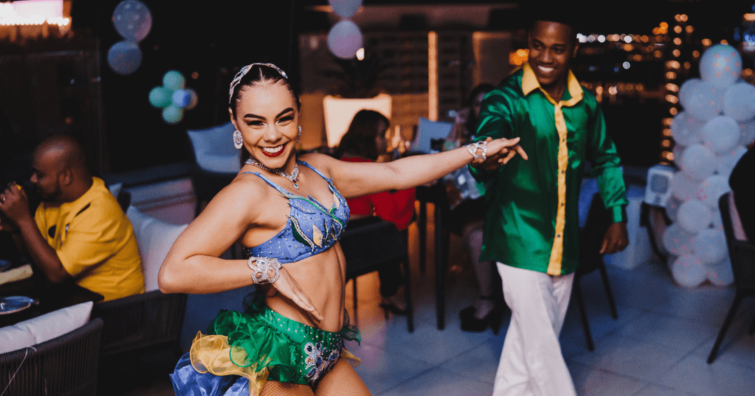 Two people dancing with brazilian costumes