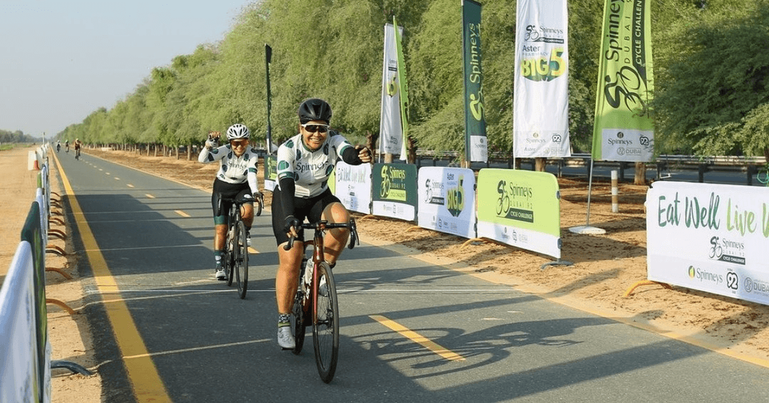 Cyclists cycling the Spinneys track race