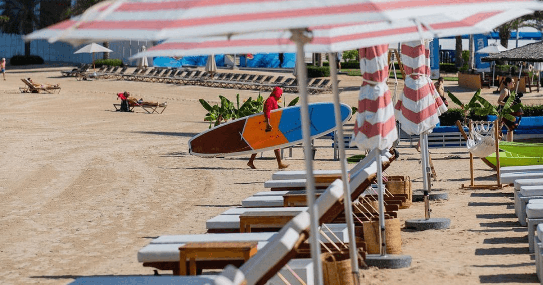 Sunbeds lined up at the beach