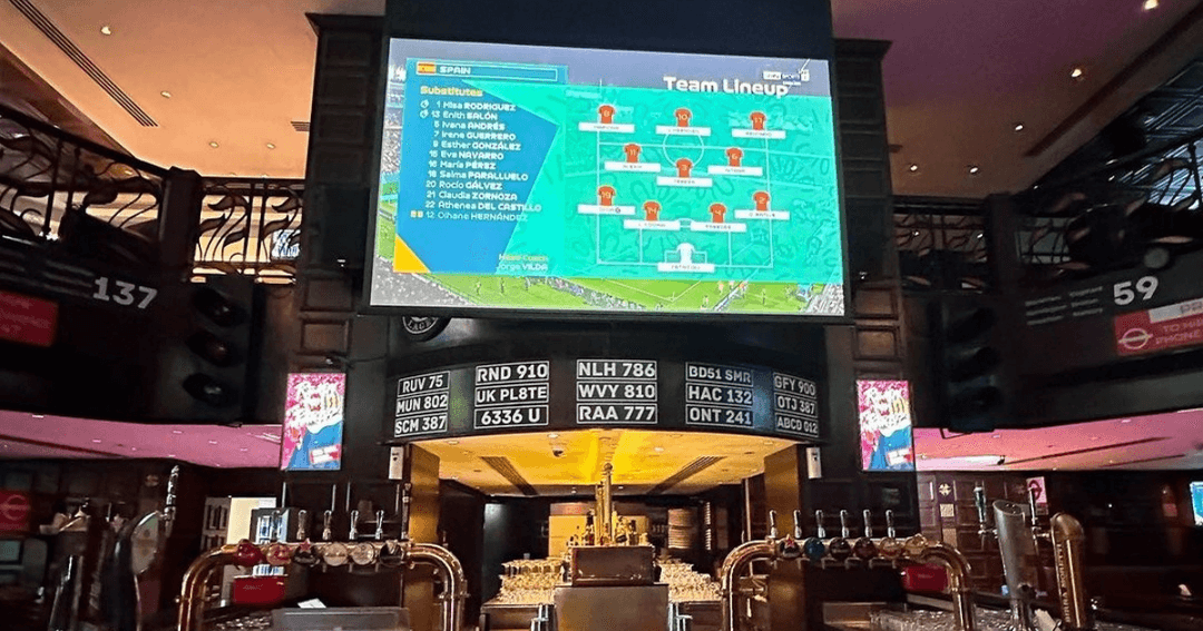 Big TV-screen showing live sports