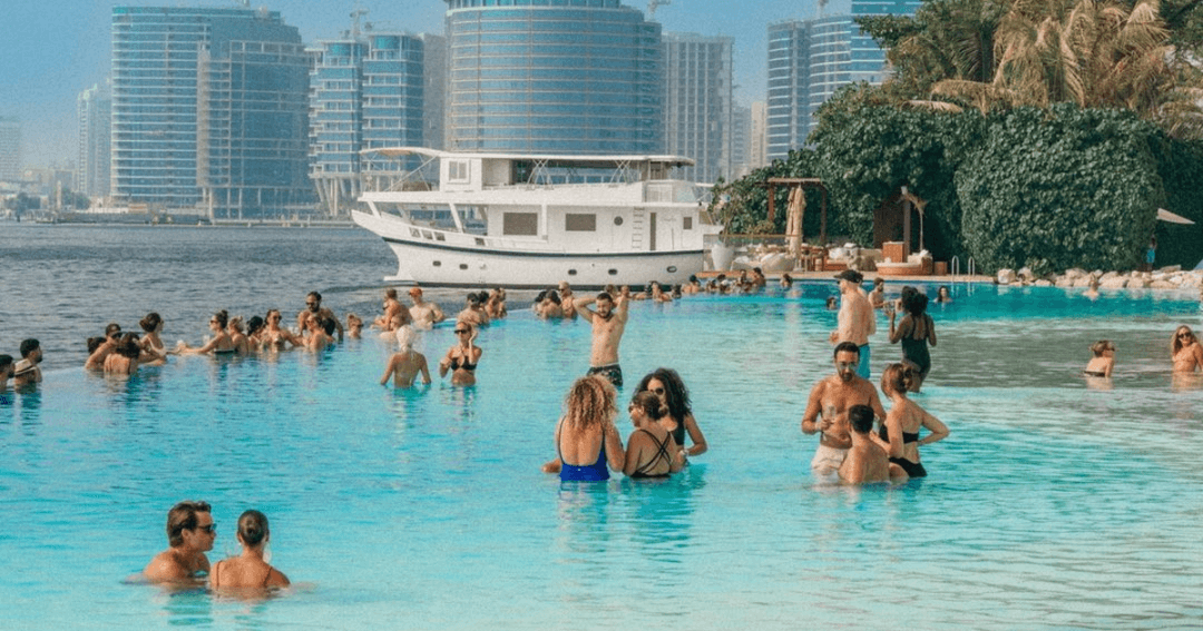 Guest in the pool overlooking the sea