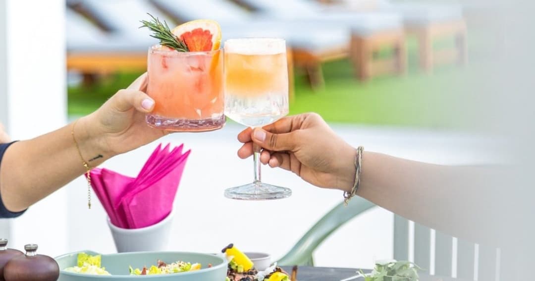 Two people toasting their drinks!