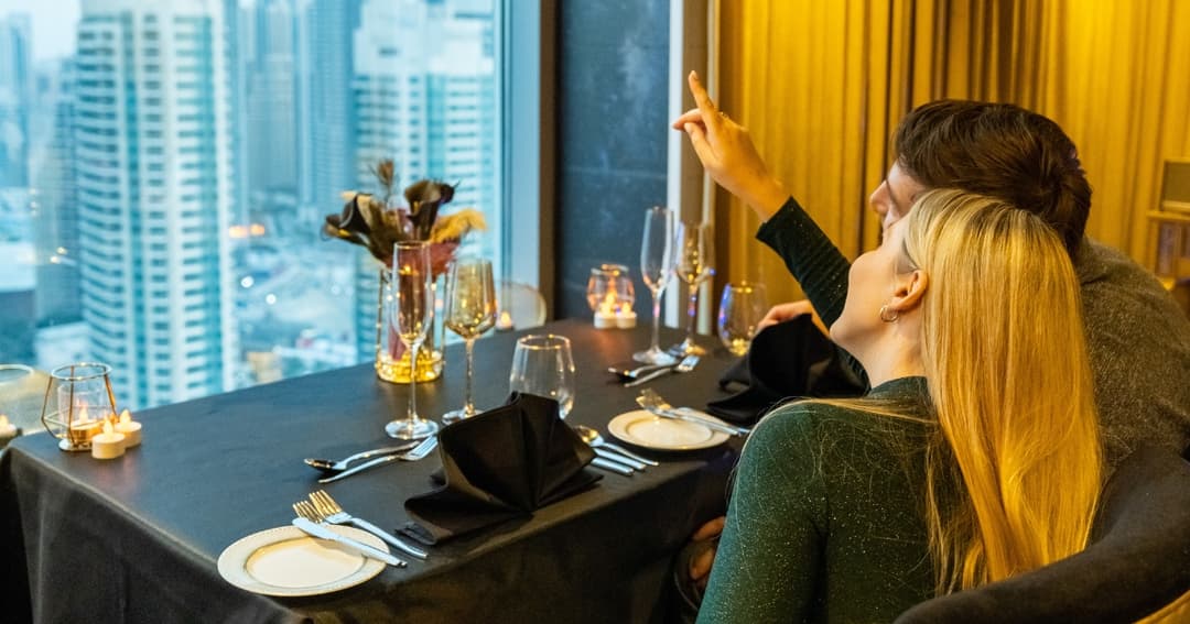 Couple sitting at romantic table set up