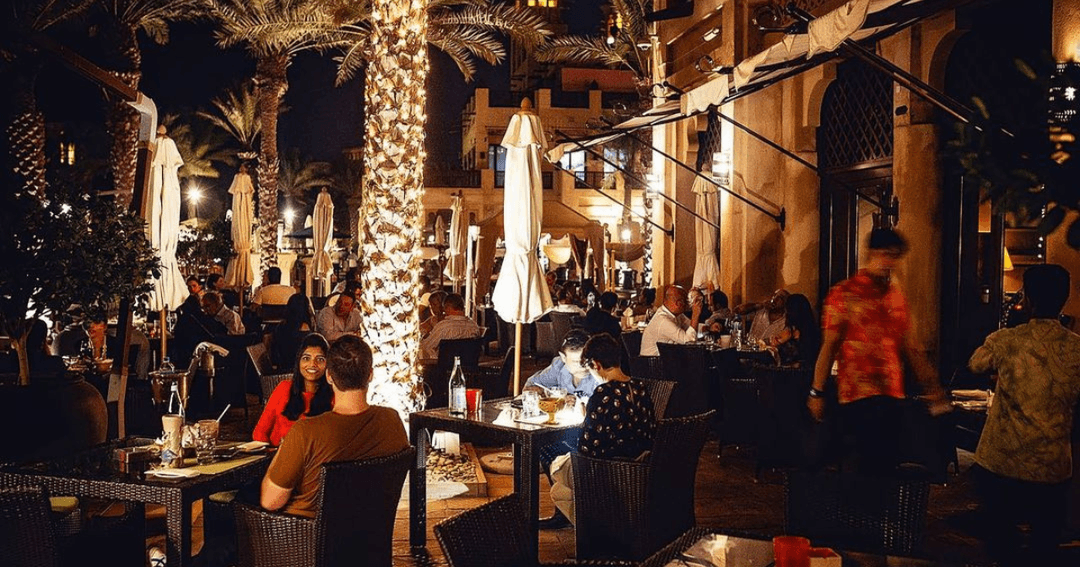 Guests dining in the outside dining area at Trader Vic