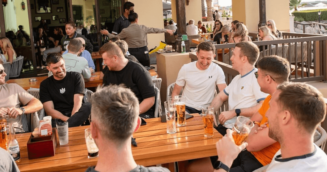 Group of men drinking beer on the terrace