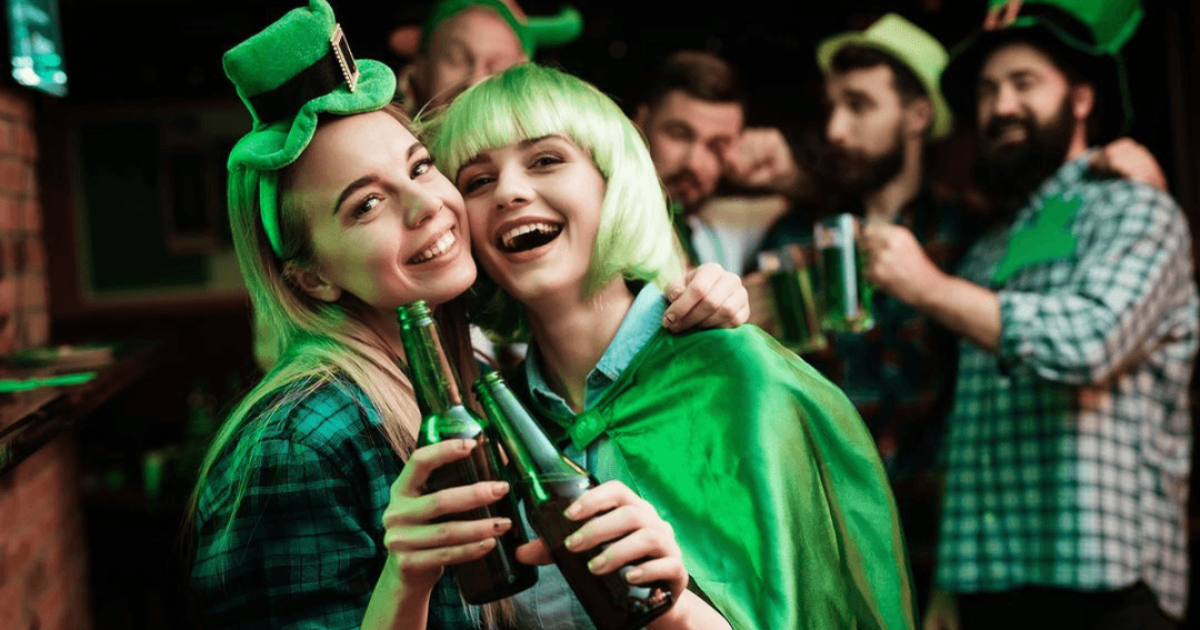 Two women dressed in green for St. Patrick's Day