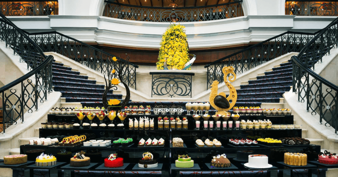 Table full of cakes and food