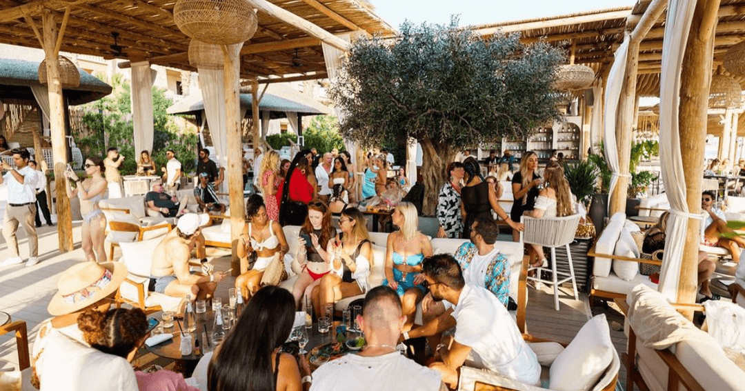 Guests enjoying a brunch by the beach