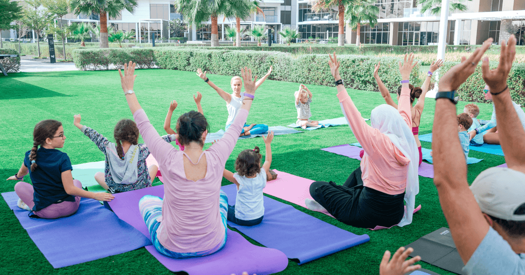 Adults and kids doing Yoga