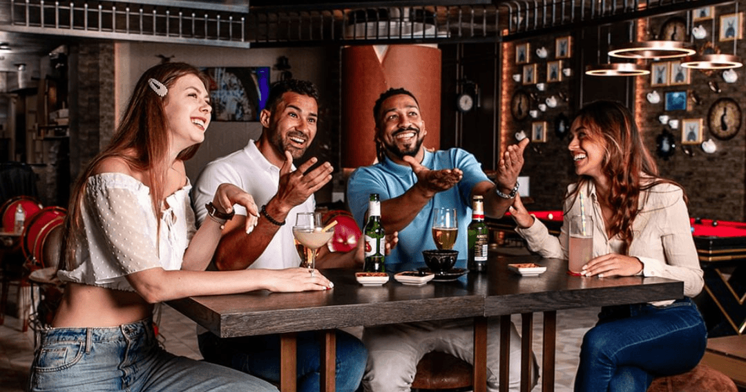 Guests enjoying drinks at a bar