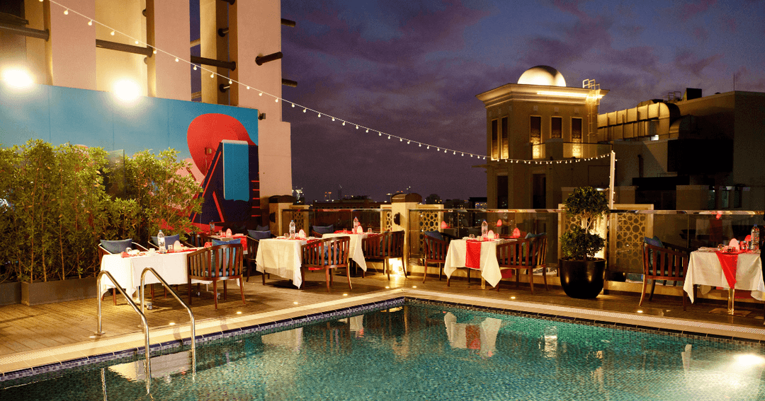 Poolside dining area at Doubletree Al Jadaf