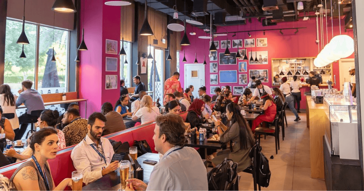 People sitting at tables in a restaurant