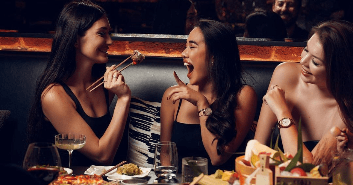 ladies enjoying drinks and dinner