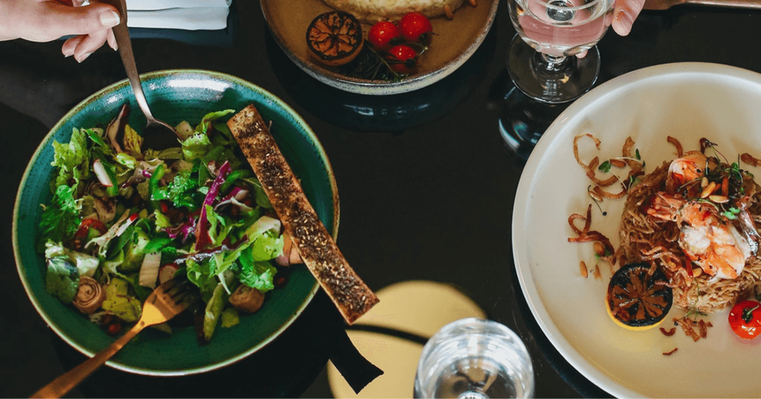 plates of salads on a table