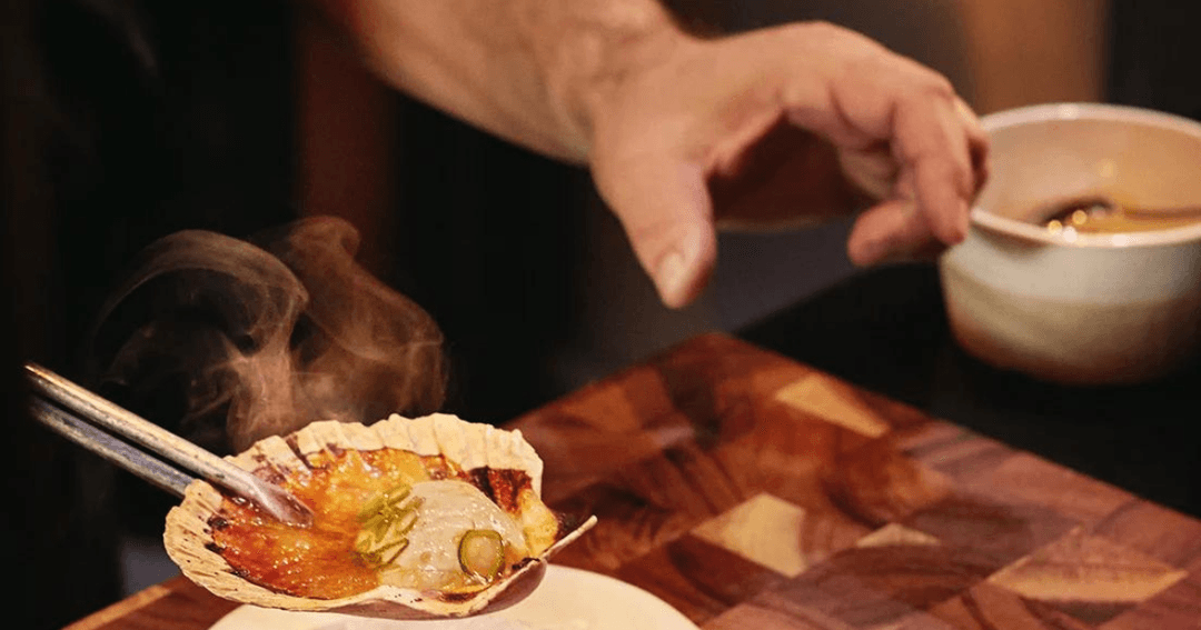 person trying food at restaurant