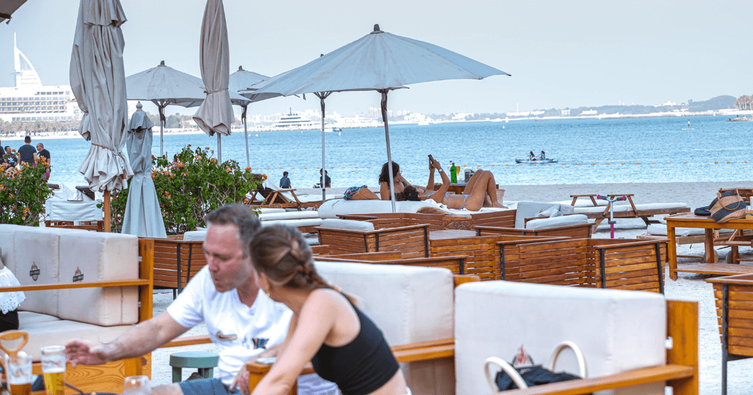 guests eating by the beach