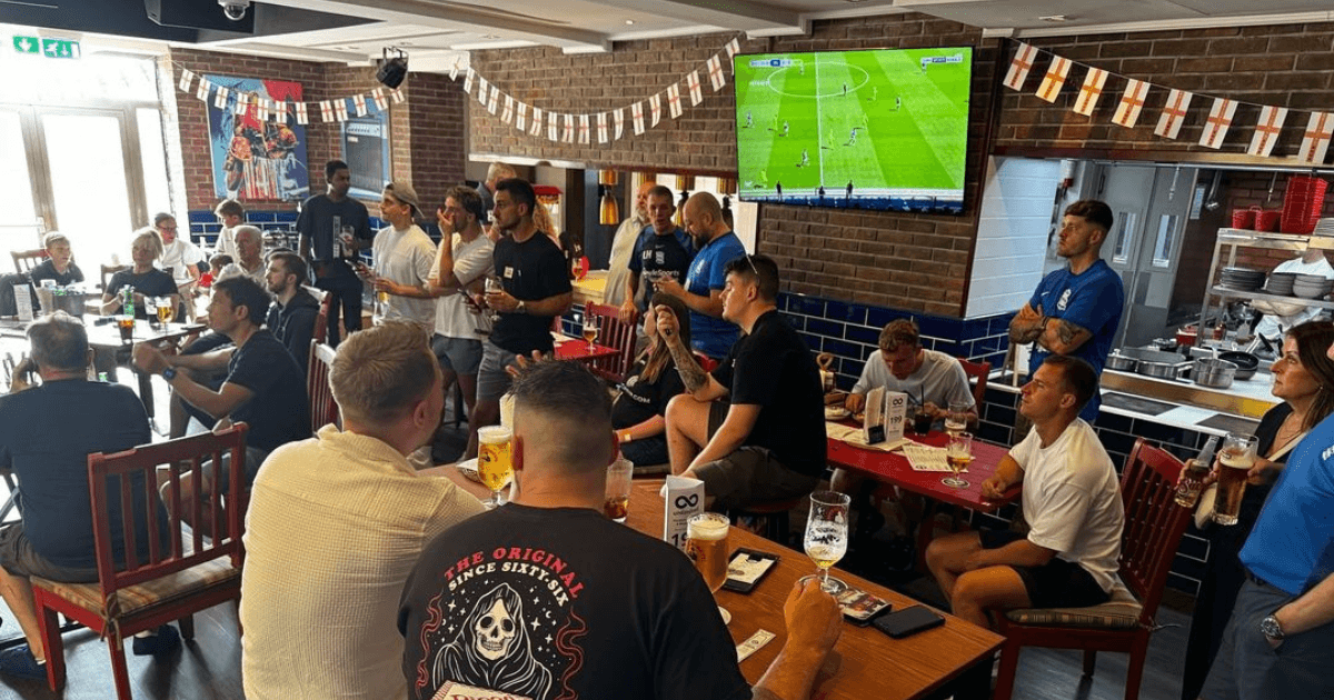 People watching live sport in a sports bar