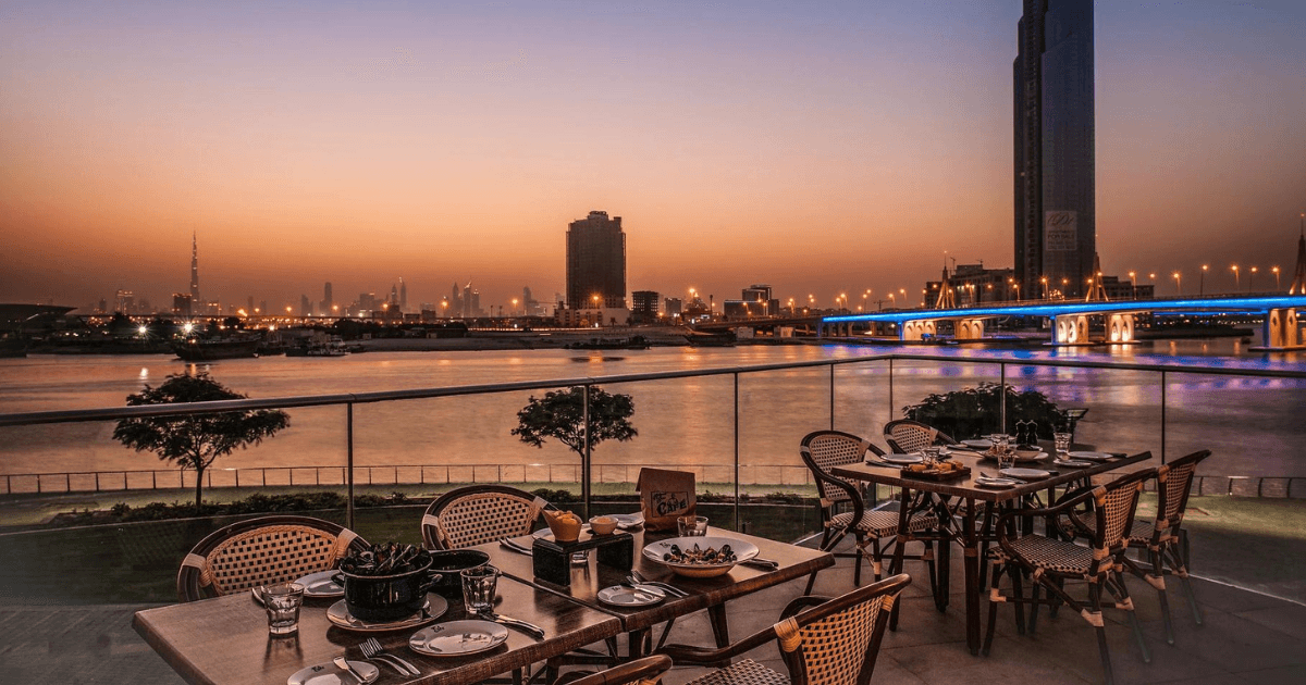 Scenic evening view from the Belgian Beer Cafe in Dubai with a stunning city skyline and waterfront.