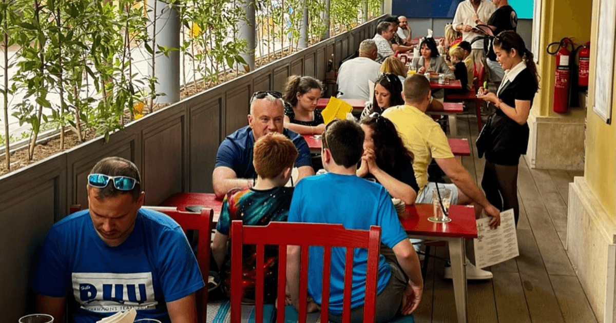 Guests dining at the outdoor seating area of Brighton Rock in Dubai, with a relaxed and social ambiance.