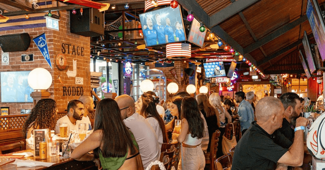 People watching football in a pub