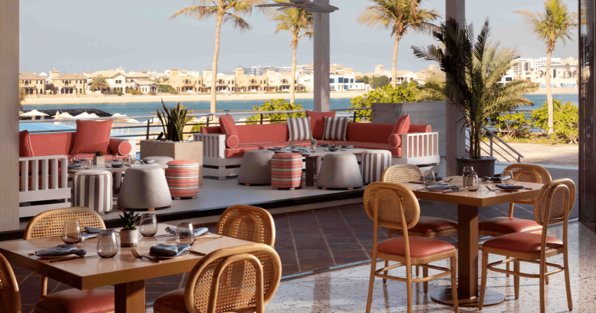 colorful outdoor seating area of la coco, dubai