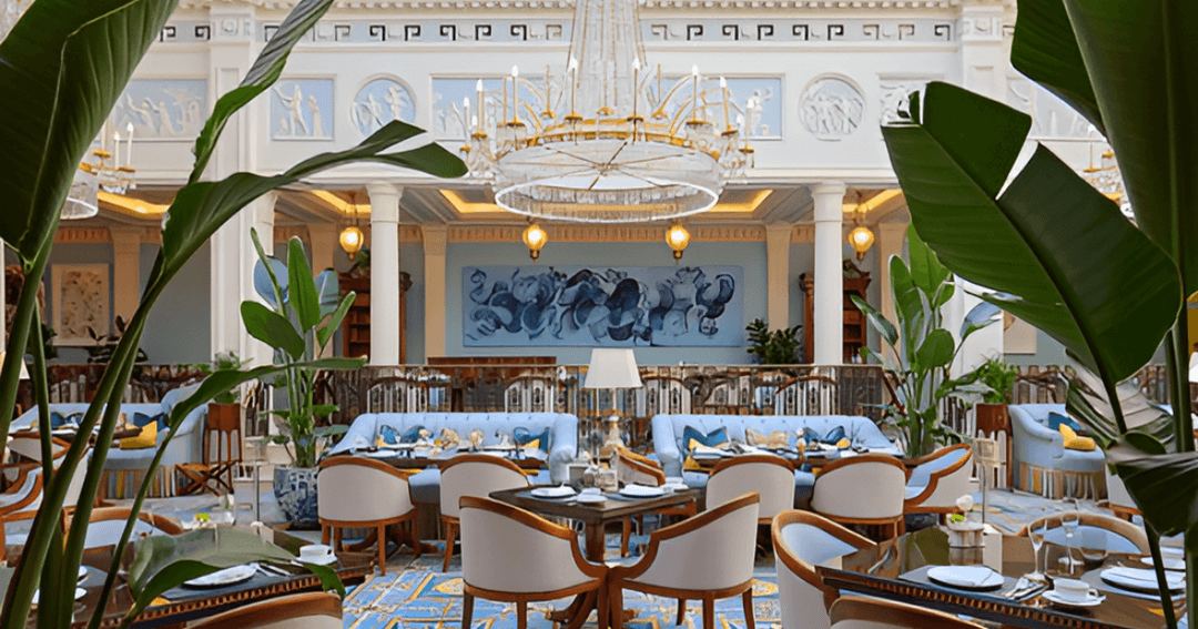 Elegant dining area at The Lanesborough London with luxurious decor and a grand chandelier.