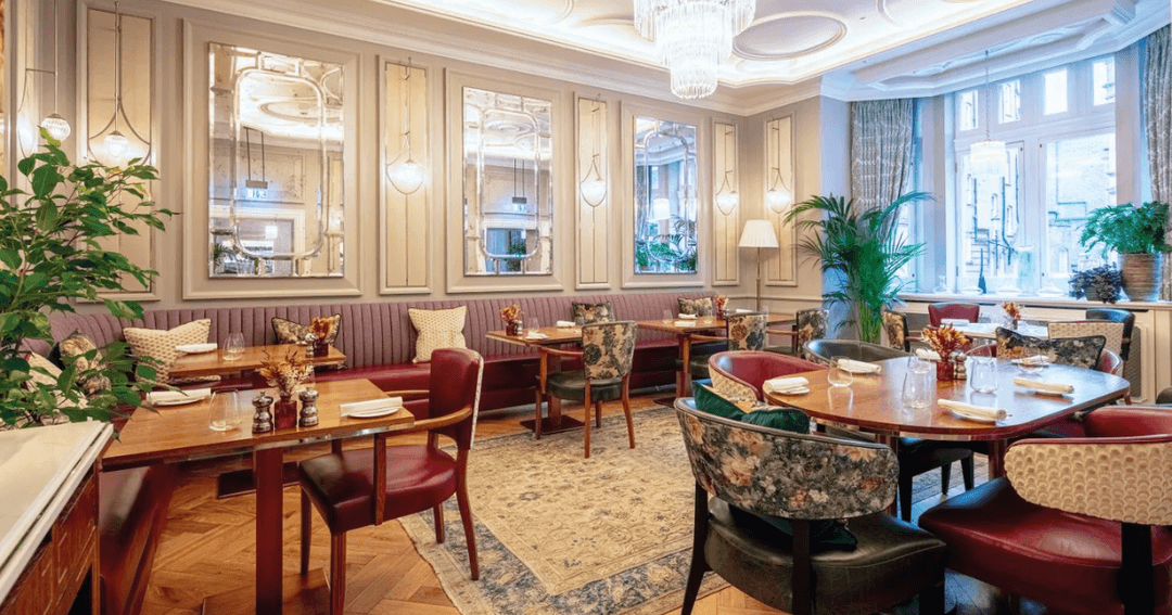 The sophisticated dining area at The Cadogan Hotel in London, featuring stylish decor, plush seating, and ambient lighting.