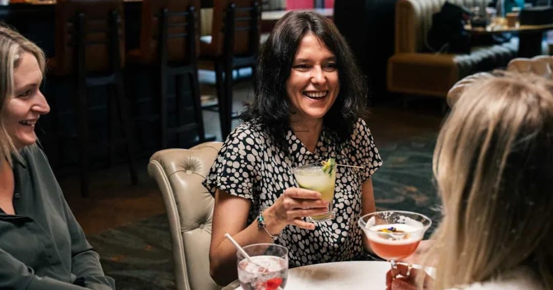 Ladies drinking at a bar