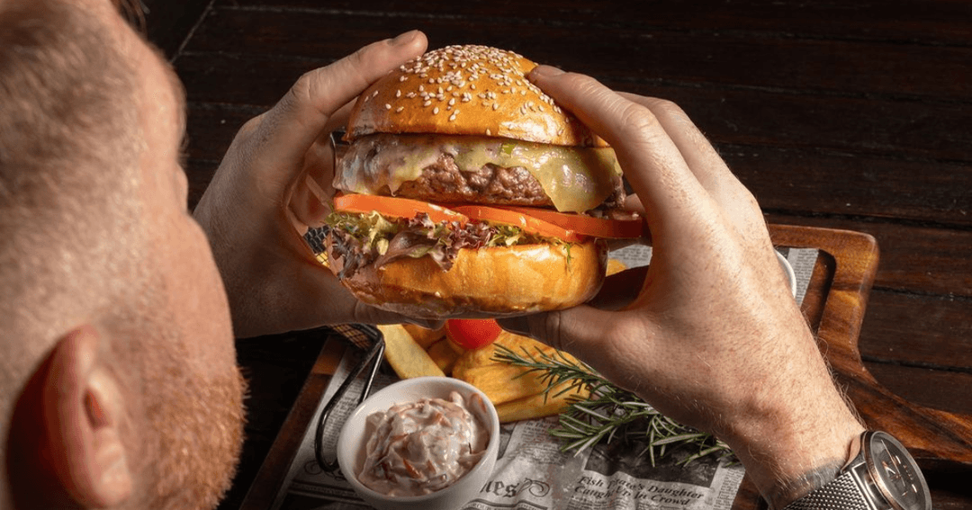 burger served at harvesters