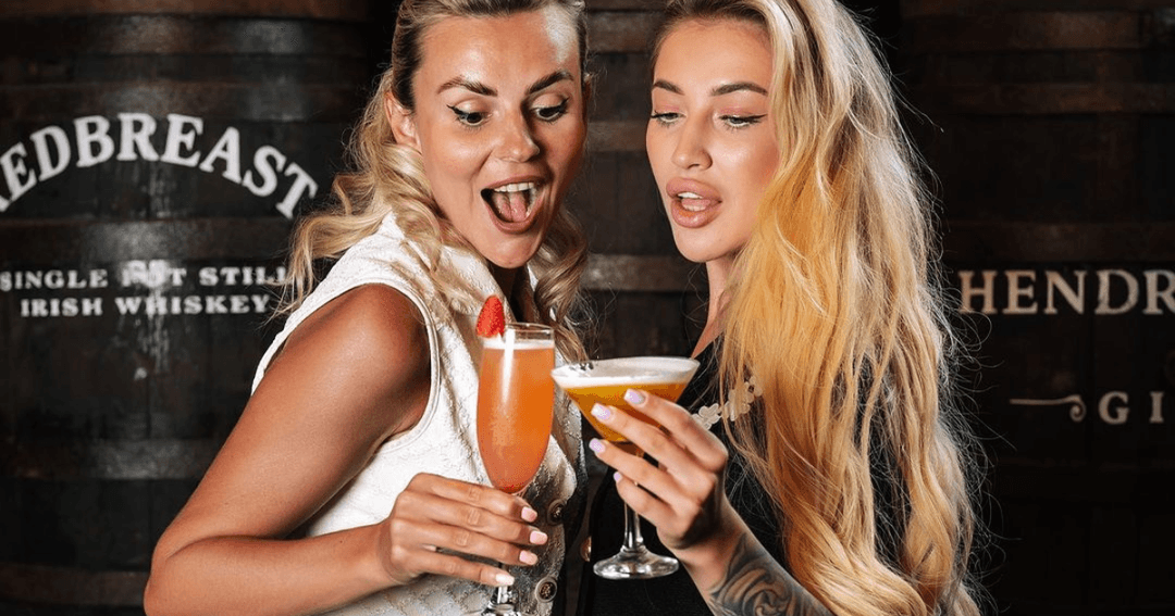 ladies posing with drinks