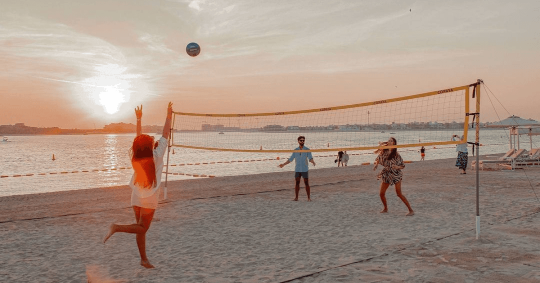 people playing voleyball at senor picos beach